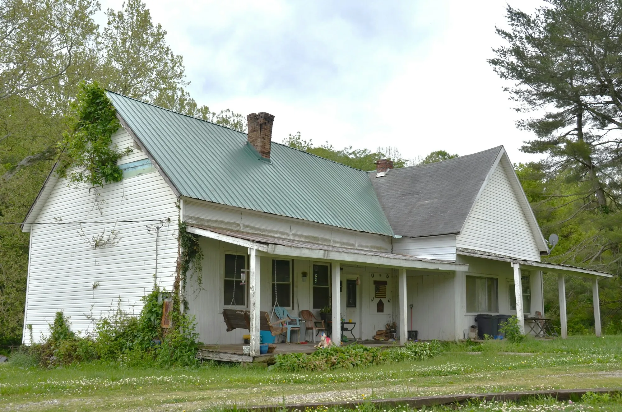 White older home with a long front porch